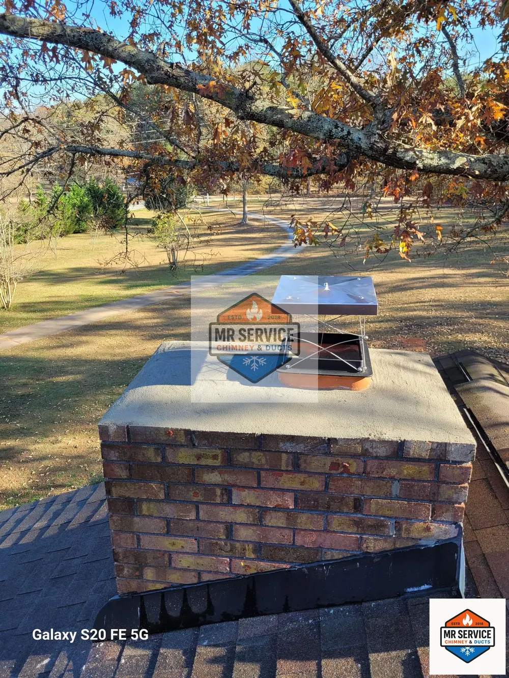 Finished chimney cap and crown work on a brick chimney