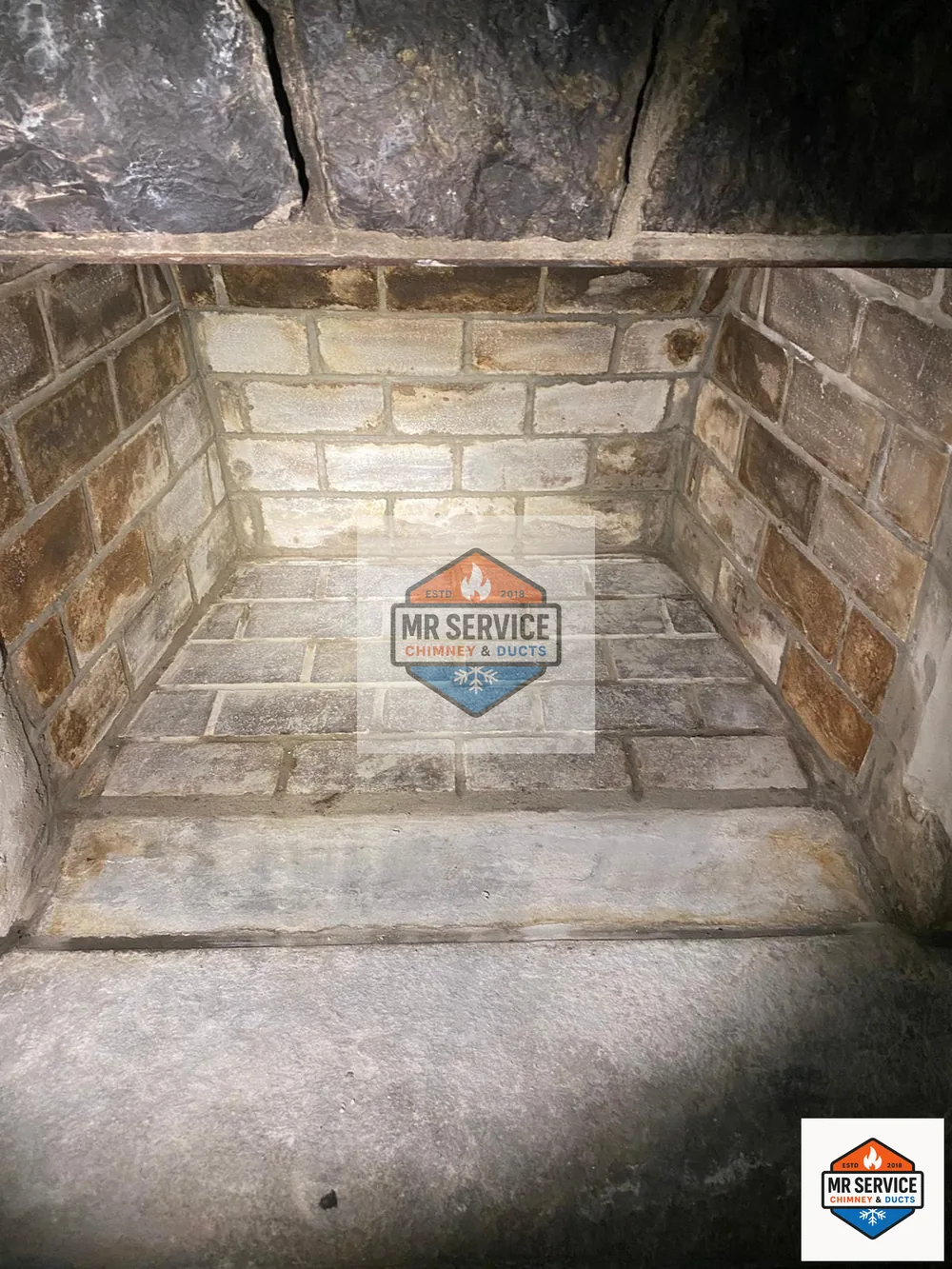 Clean firebox interior after fireplace service